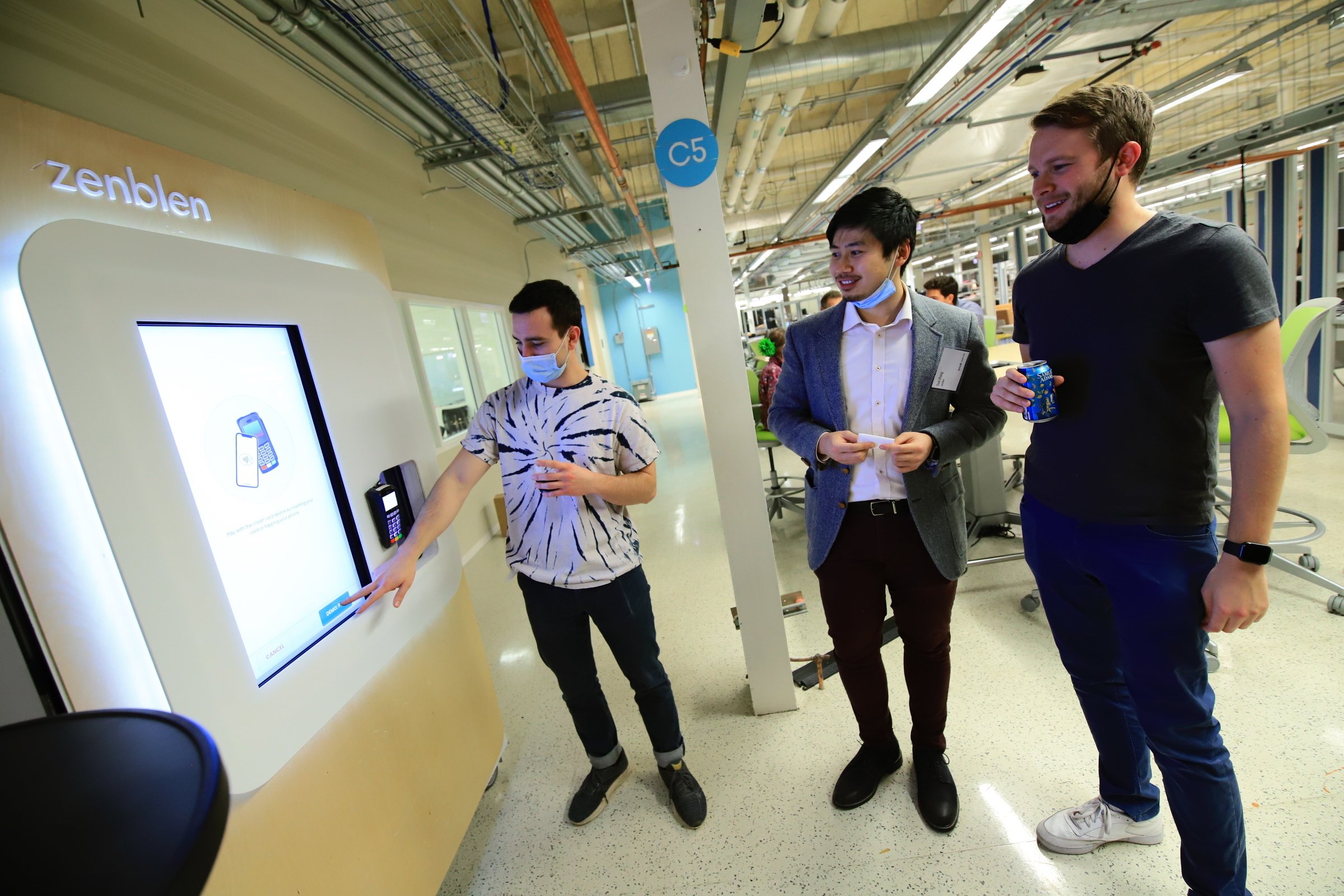 Ben Salazar, Associate Mechanical Engineer, Tom Zhang, Co-founder & CEO of ZenBlen, and Daniel Bernacki, Lead Engineer, test their prototype at mHUB physical product innovation center