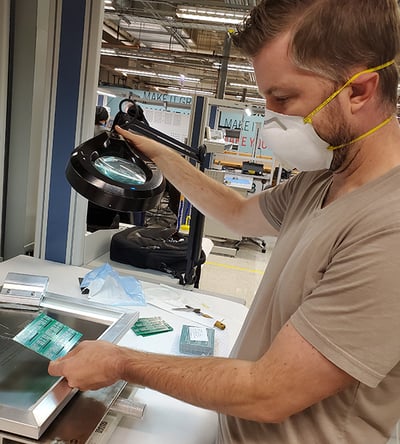 Man working in electronics lab