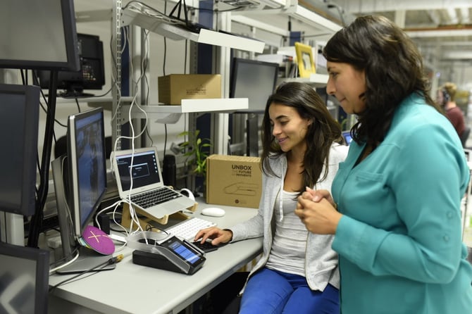 two women looking at laptop