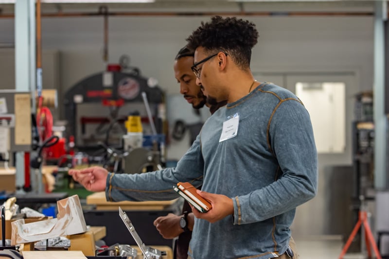 Preston Njapa and Kheperah Ray, two hardtech development fellows working at the mHUB prototyping lab