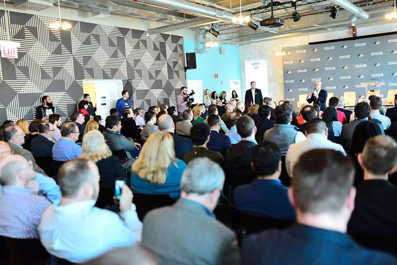 Audience listening to panel in mHUB event space-edit