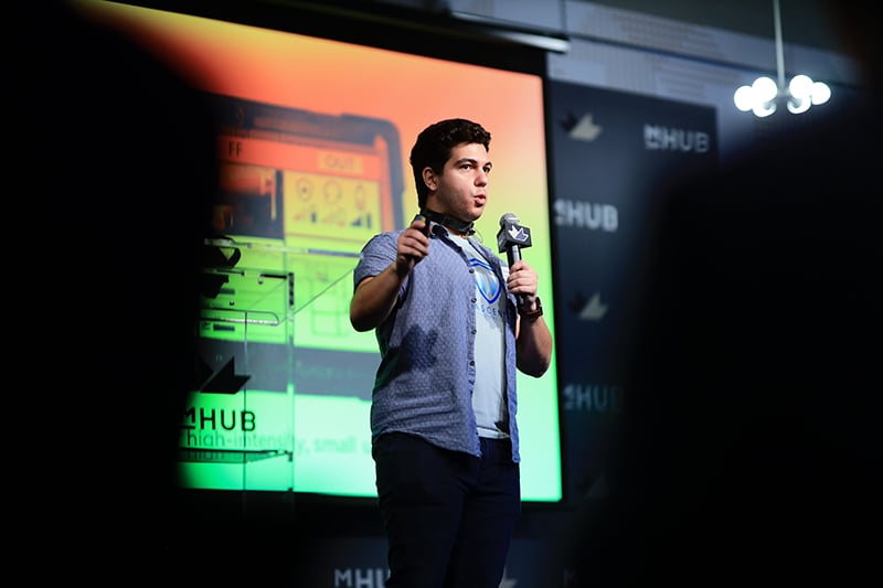 Startup founder pitching at mHUB demo day event-edit