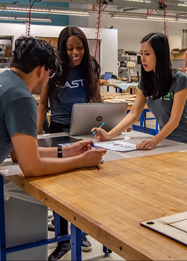 Cast21 entrepreneurs work in mHUB's assembly area of the prototyping lab