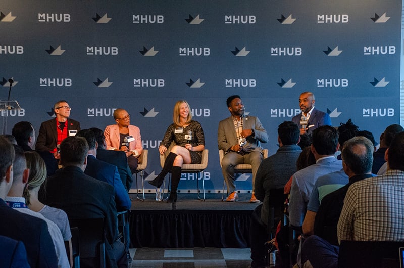 mHUB-partners-in-panel-discussion-on-stage-join-edit